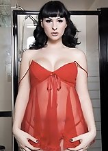 Sweet Bailey Jay posing in a sexy red babydoll